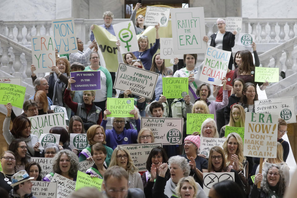 This Tuesday, Dec. 3, 2019, photo, shows Equal Rights Amendment supporters gathered during a rally at the Utah State Capitol, in Salt Lake City. The renewed national push to ratify the Equal Rights Amendment is coming to conservative Utah, where supporters are launching a long-shot bid to challenge Virginia in becoming a potential tipping point despite opposition from the influential Church of Jesus Christ of Latter-day Saints. (AP Photo/Rick Bowmer)