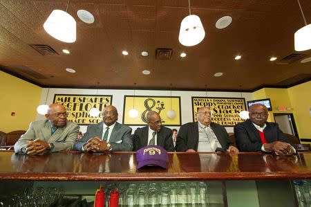 Five members of the Friendship 9 (L-R) Willie Thomas Massey, Willie, E. McCleod, James F. Wells, Clarence Graham and David Williamson, Jr. sit at the lunch counter at Five & Dine diner in Rock Hill, South Carolina, December 17, 2014. REUTERS/Jason Miczek