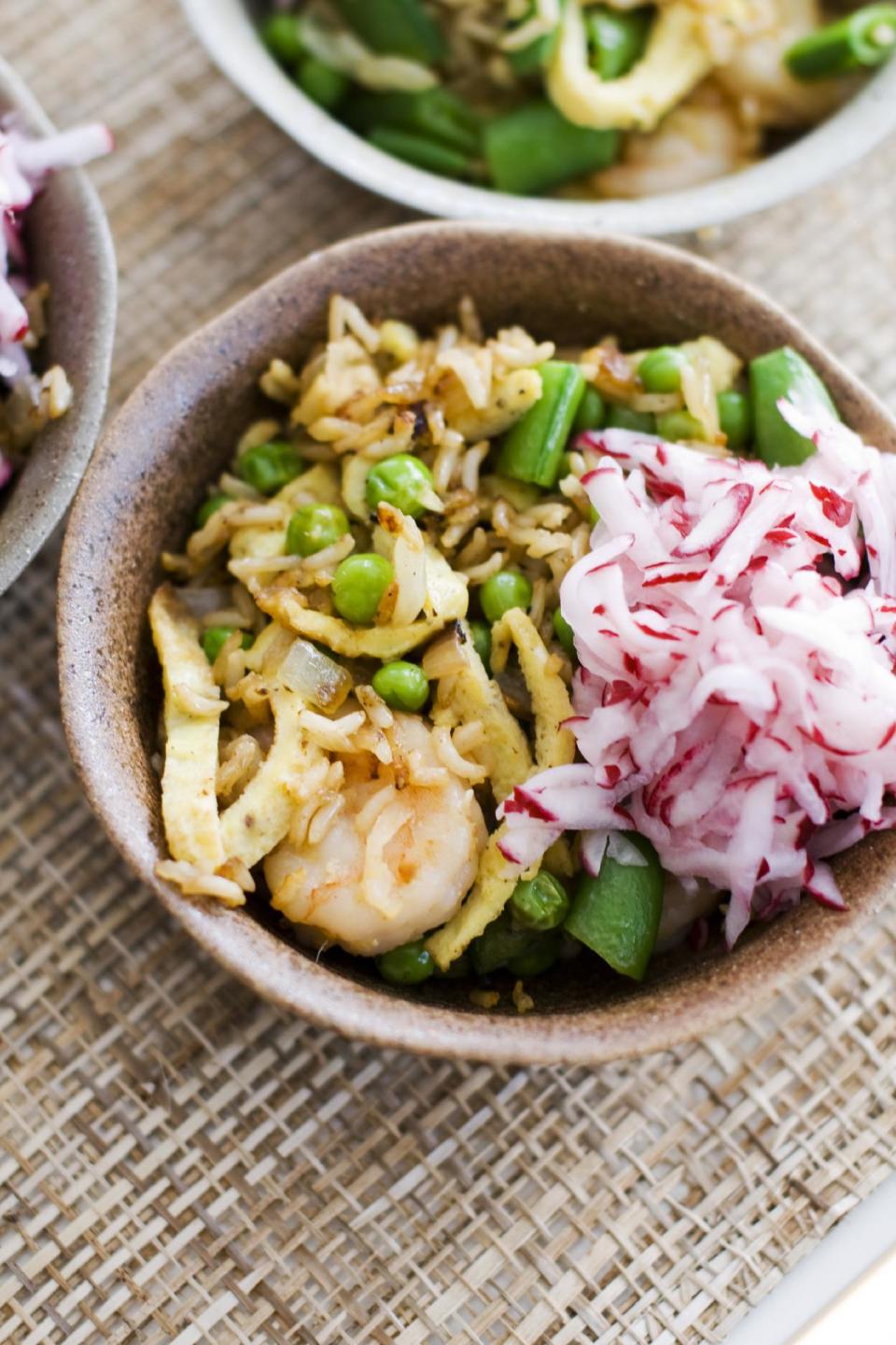 In this image taken on April 8, 2013, shrimp fried rice with pickled radishes is shown served in bowls in Concord, N.H. (AP Photo/Matthew Mead)