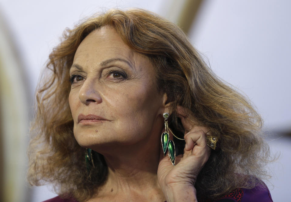 Designer Diane von Furstenberg speaks to reporters backstage before showing her Fall 2014 collection during Fashion Week in New York, Sunday, Feb. 9, 2014. (AP Photo/Seth Wenig)