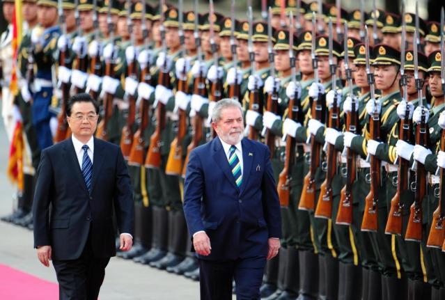 Luiz Inacio Lula da Silva and Hu Jintao review an honour guard at a welcoming ceremony at the Great Hall of the People in Beijing in 2009.