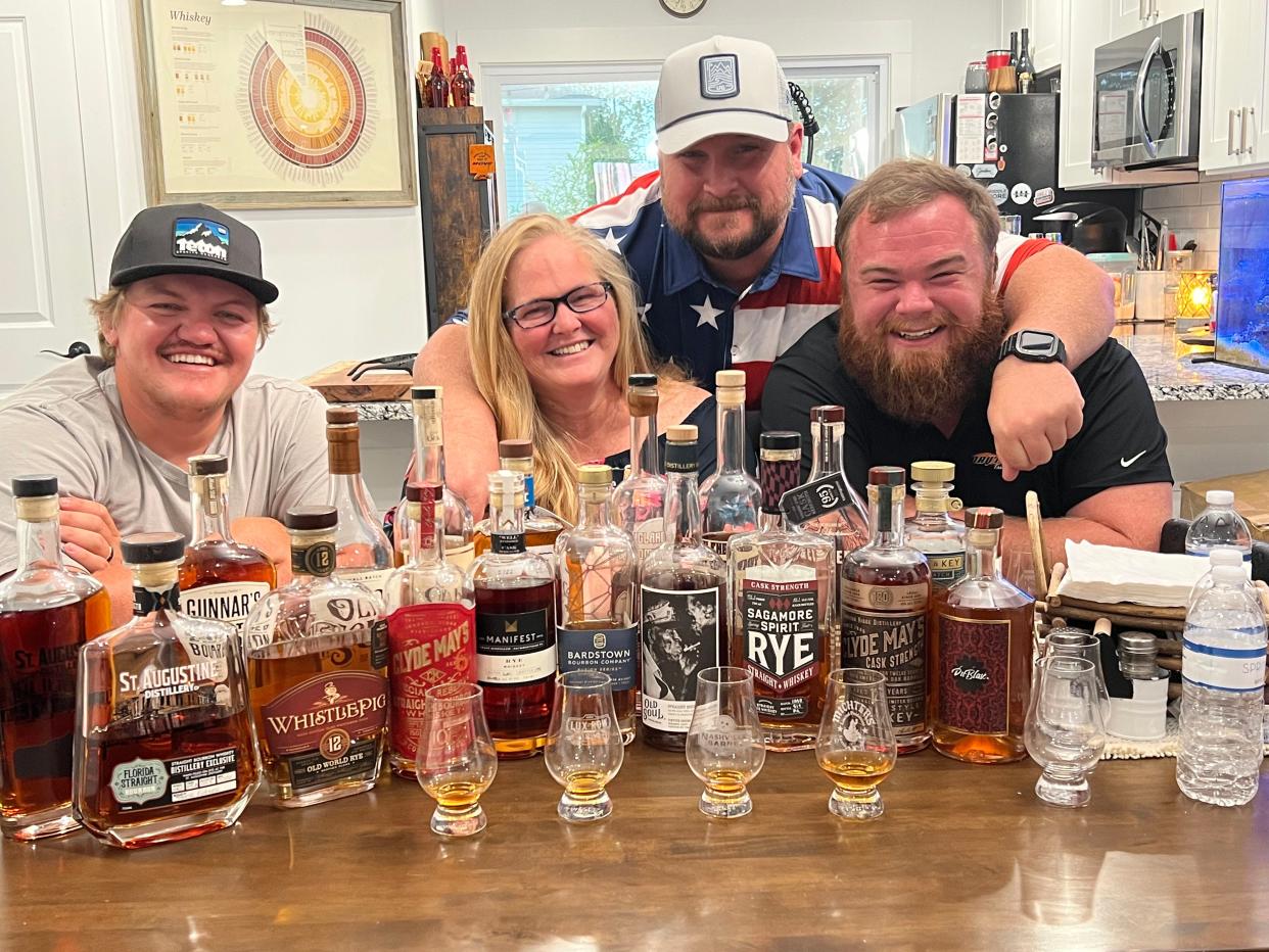 Teresa Eichner (center) poses with the three men who helped her launch the Jax Bourbon Social fundraiser for the National MS Society: Cody Mitchko (from left) Andy Goethe and Jordan Muhlbauer.