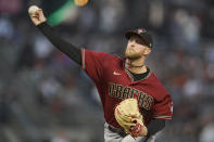 Arizona Diamondbacks' Merrill Kelly pitches against the San Francisco Giants during the first inning of a baseball game in San Francisco, Wednesday, Sept. 29, 2021. (AP Photo/Jeff Chiu)