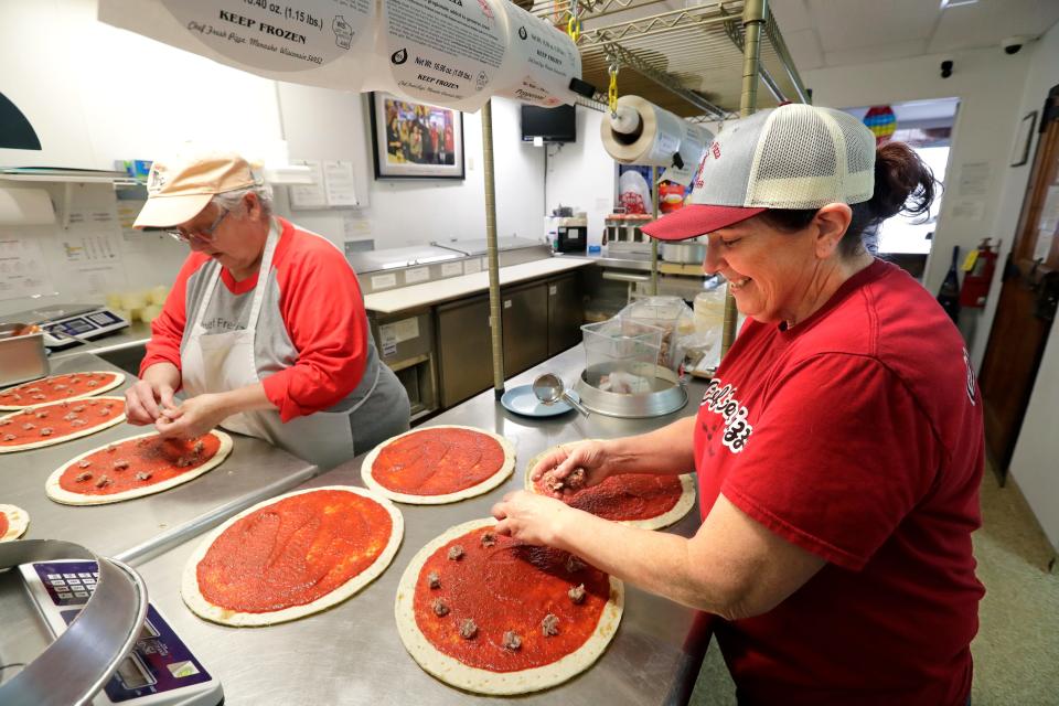 Toni Pietkauskis, left, and co-owner Carol Doran prepare pizzas made with the original sauce recipe when Chef Fresh Pizza opened in 1969.