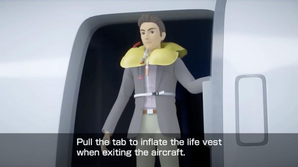 Screenshot from Japan Airlines safety video shows an animated passenger wearing a life vest