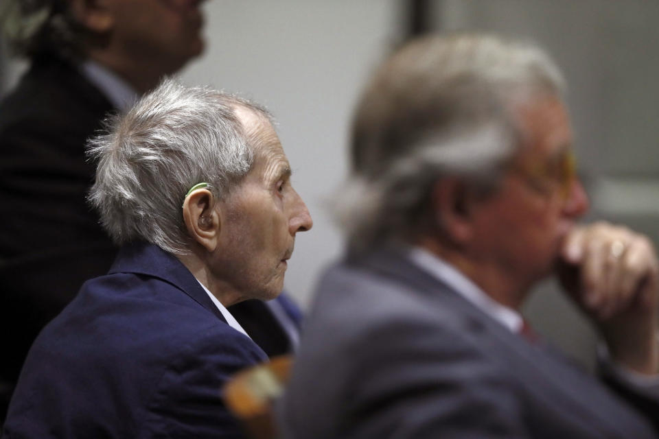 Real estate heir Robert Durst sits with his defense attorney Dick DeGuerin during his murder trial at the Airport Branch Courthouse in Los Angeles on Wednesday, March 4, 2020. After a Hollywood film about him, an HBO documentary full of seemingly damning statements, and decades of suspicion, Durst is now on trial for murder. In opening statements Wednesday, prosecutors will argue Durst killed his close friend Susan Berman before New York police could interview her about the 1982 disappearance of Durst's wife. (Etienne Laurent/EPA via AP, Pool)