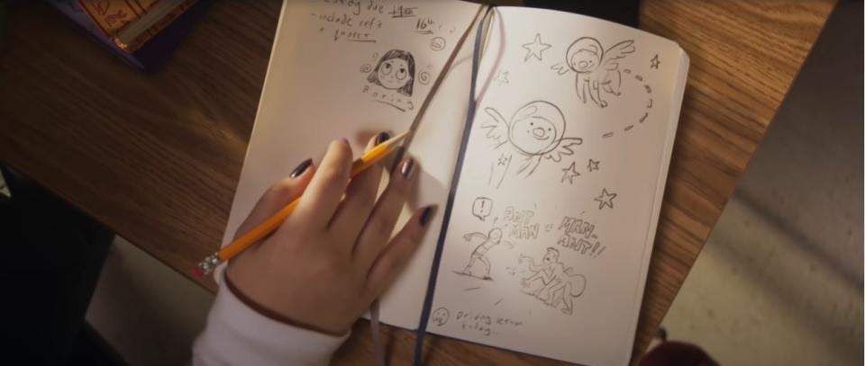 A shot of Kamala's notebook, showing doodles of flying pigs in space, Ant-Man versus Man-Ant and scribbled notes like "essay due 16th, include refs and quotes" and "driving lesson today"