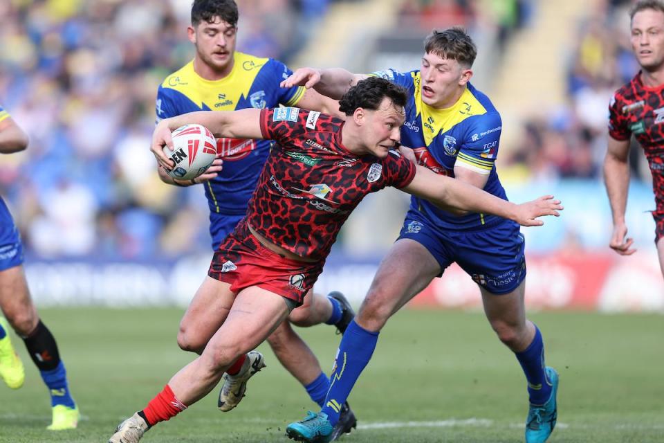 Matty Nicholson tackles Leigh's Lachlan Lam <i>(Image: SWPix.com)</i>