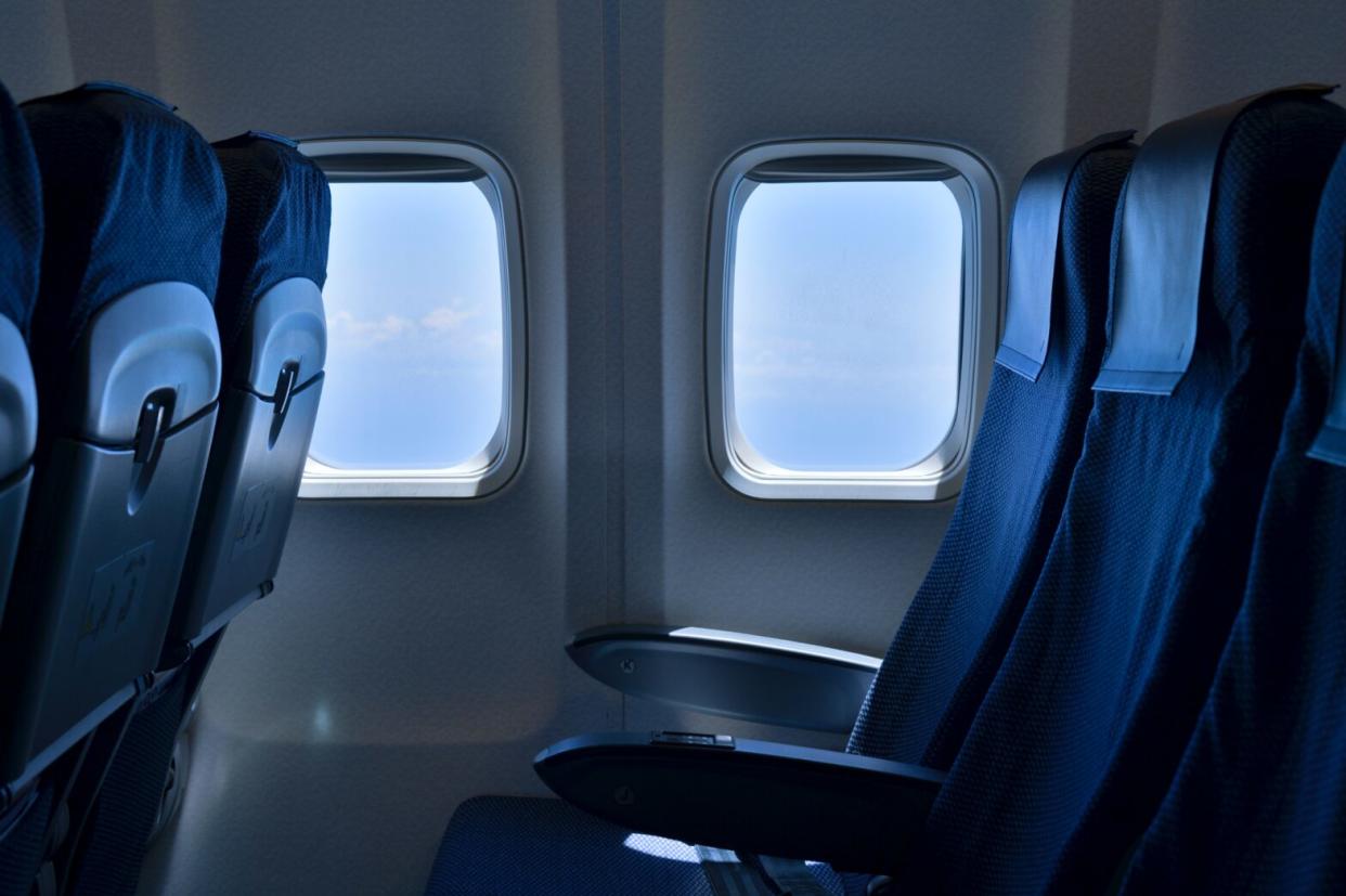 Airplane seat near window - Best Underseat Luggage Options for travelers