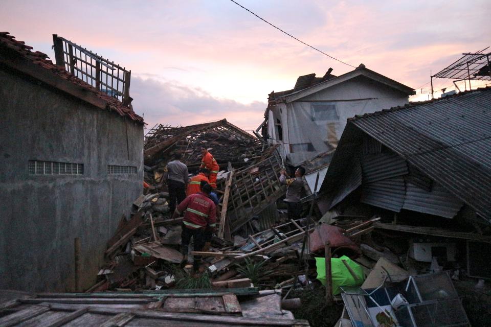 Rescuers search for survivors at the ruins of houses damaged by an earthquake in Cianjur, West Java, Indonesia, on Monday.