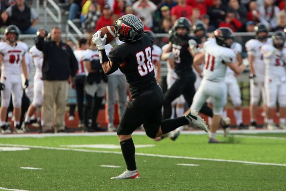 Highland wideout Wyatt Rinderer hauls in a long pass over the middle from Blake Gelly during an IHSA Class 5A second-round playoff game on Saturday, Nov. 4, 2023, at Highland High School. Jody Becker