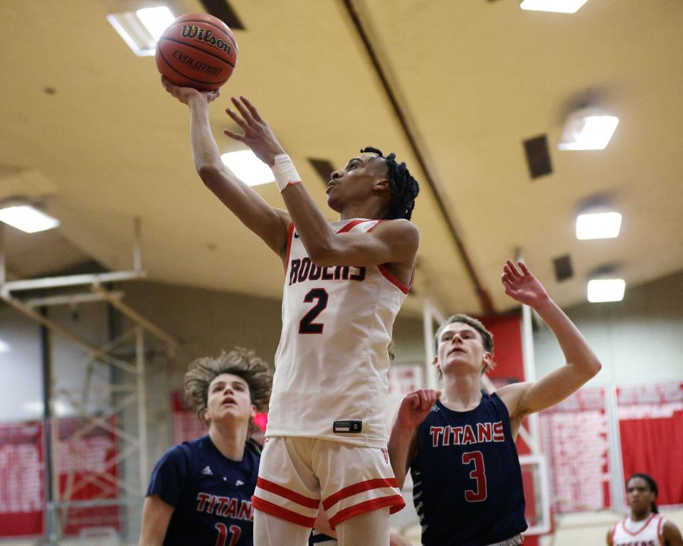 Rogers High School's Elijah Neal, shown here in a regular-season game against Toll Gate, scored a team-best 16 points in the Vikings season-ending loss to Hendricken in the open state tournament on Thursday night.