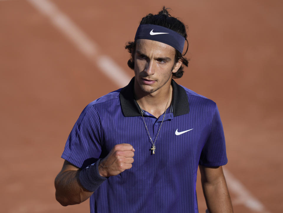 Italy's Lorenzo Musetti celebrates after winning a point against Belgium's David Goffin during their first round match on day two of the French Open tennis tournament at Roland Garros in Paris, France, Monday, May 31, 2021. (AP Photo/Thibault Camus)