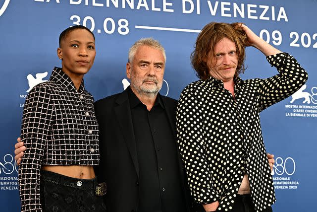 <p>GABRIEL BOUYS/AFP via Getty</p> US actress Jojo T. Gibbs (left), French director and producer Luc Besson (center) and US actor Caleb Landry Jones (right) pose during the photocall of the movie "Dogman" presented in competion at the 80th Venice Film Festivalon August 31, 2023 at Venice Lido.