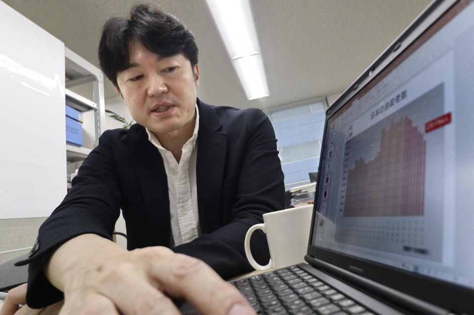 In this March 2, 2017, photo, Yasuyuki Shimizu, founder of Lifelink, a nonprofit that lobbies for suicide-prevention measures, speaks during an interview at his office in Tokyo. Fewer Japanese are taking their own lives, a glimmer of hope in a country with one of the world’s highest suicide rates. “Now we can talk about suicides,” said Shimuzu. “I believe the change in environment has made it easier for the needy to seek help.” (AP Photo/Shizuo Kambayashi)