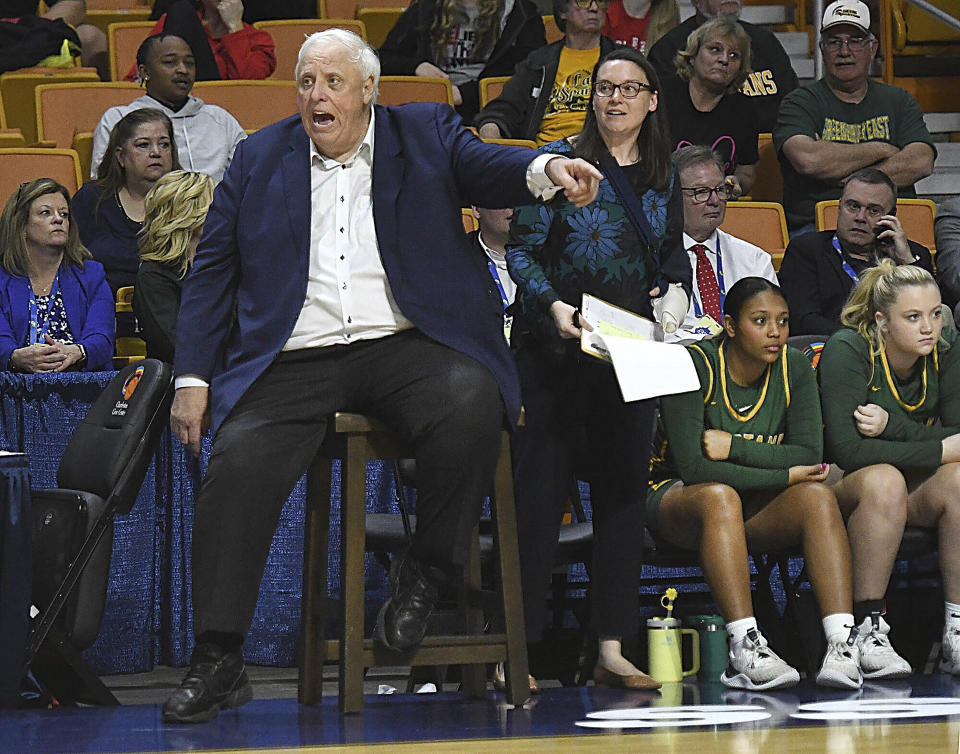 West Virginia Gov. Jim Justice, coach of the Greenbrier East High School girls basketball team, reacts to action on the court at the state tournament Tuesday, March 5, 2024, in Charleston, W.Va. (Rick Barbero/The Register-Herald via AP)