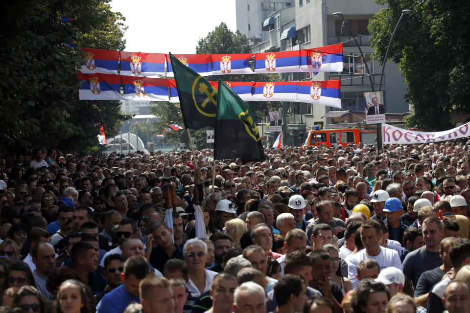 Kosovo Serbs attend a rally of Serbian President Aleksandar Vucic in the northern, Serb-dominated part of Mitrovica, Kosovo, Sunday, Sept. 9, 2018. NATO-led peacekeepers in Kosovo say the safety of Serbia President Aleksandar Vucic during a visit to Kosovo isn't threatened despite roadblocks that prevented his visit to a central Serb-populated village. (AP Photo/Darko Vojinovic)