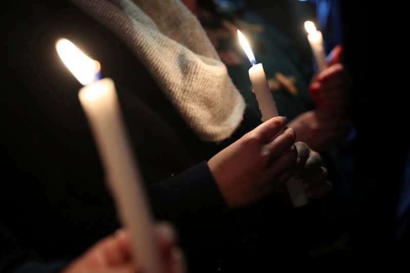 Anti-racism campaigners take part in a vigil, following the discovery of 39 bodies in a truck container, outside the Home Office in London