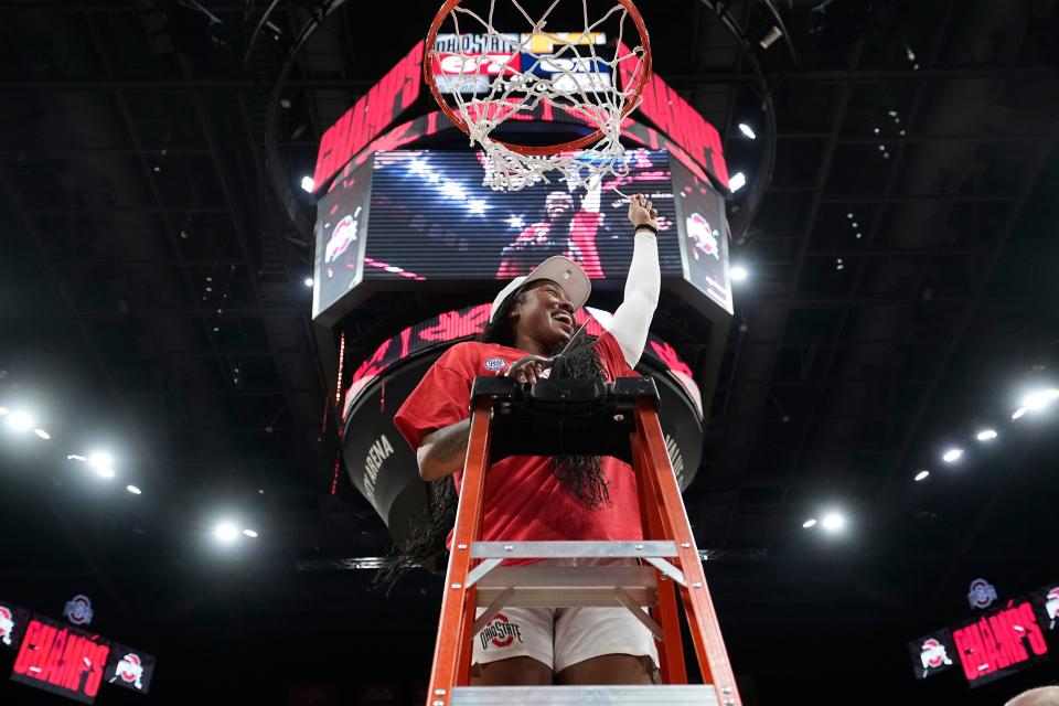 Feb 28, 2024; Columbus, OH, USA; Ohio State Buckeyes forward Cotie McMahon (32) cuts down the net as the team celebrates winning the Big Ten regular season title after the 67-51 win over the Michigan Wolverines in the NCAA women’s basketball game at Value City Arena.