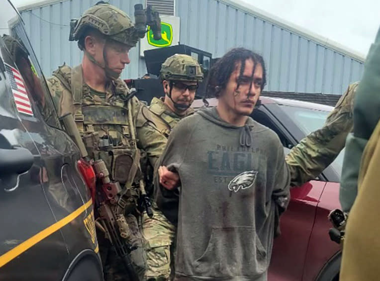 Danelo Souza Cavalcante is taken into custody at the Pennsylvania State Police barracks at Avondale Pa., on Wednesday, Sept. 13, 2023. Cavalcante was captured Wednesday after eluding hundreds of searchers for two weeks.(Pennsylvania State Police via AP)