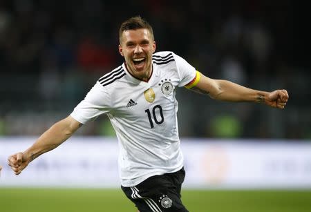 Football Soccer - Germany v England - International Friendly - Signal-Iduna-Park, Dortmund, Germany - 22/3/17 Germany's Lukas Podolski celebrates scoring their first goal Reuters / Wolfgang Rattay Livepic