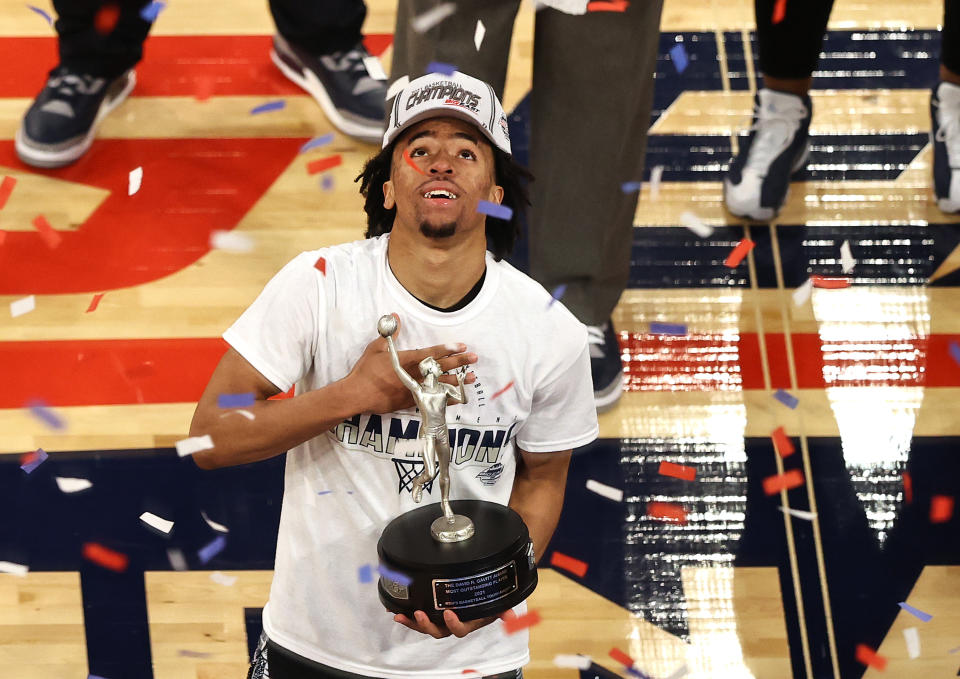 NEW YORK, NEW YORK - MARCH 13: Dante Harris #2 of the Georgetown Hoyas celebrates after he is awarded the Most Outstanding Player of the Big East Championship Tournament after the Big East Championship game against the Creighton Bluejays at Madison Square Garden on March 13, 2021 in New York City.The Georgetown Hoyas defeated the Creighton Bluejays 73-48 to win the title. (Photo by Elsa/Getty Images)