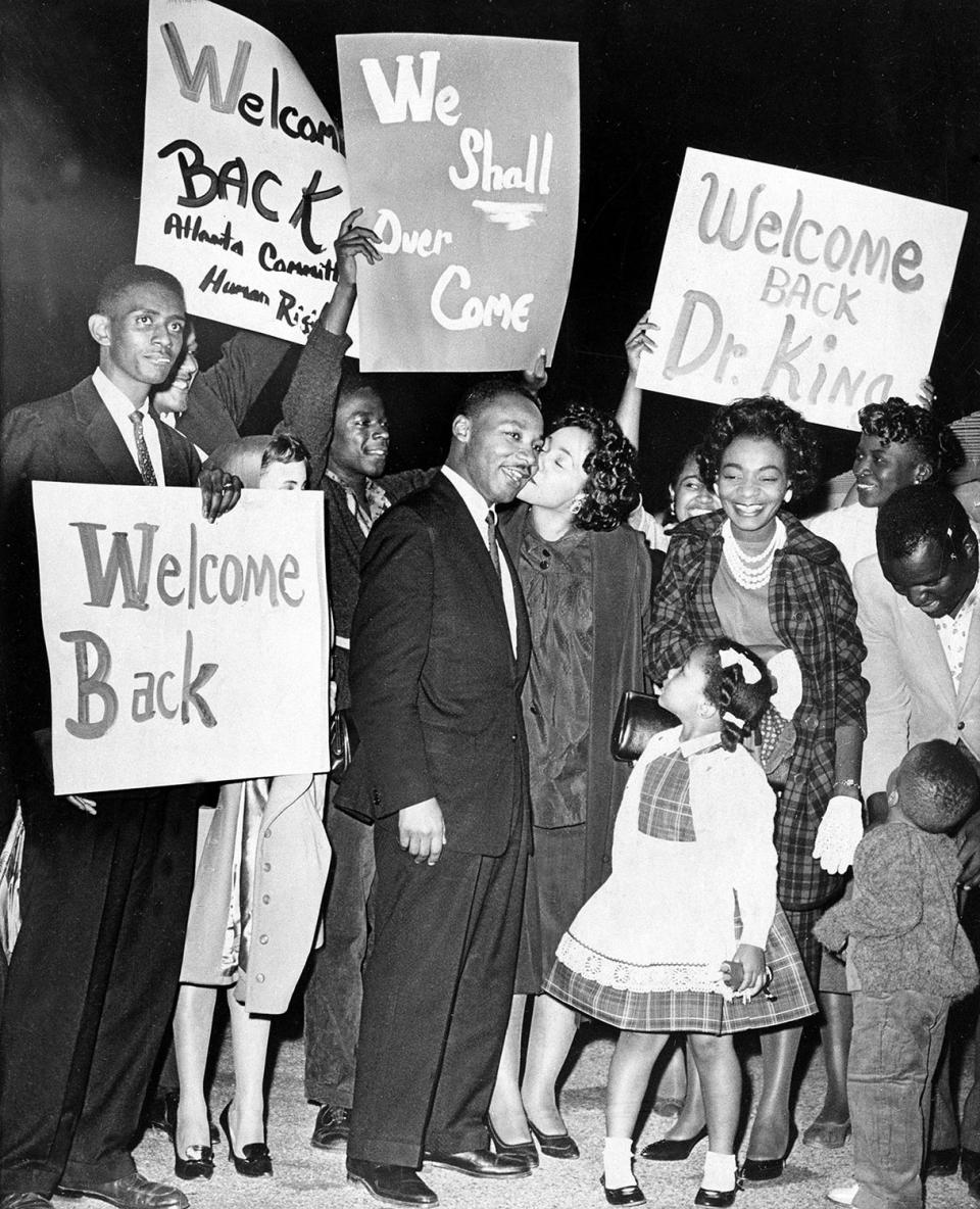 <p>Dr. Martin Luther King is given a welcome home kiss by his wife Coretta, upon his return to Atlanta following his release from Reidsville State Prison on bond, on Oct. 27, 1960. King’s children, Yolanda, 5, and Martin Luther III, 3, join the welcome celebration. (AP Photo) </p>