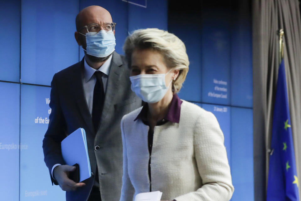 European Council President Charles Michel, left, and European Commission President Ursula von der Leyen leave after a joint news conference at the end of a EU summit video conference at the European Council headquarters in Brussels, Thursday, Jan. 21, 2021. European Union leaders assessed more measures to counter the spread of coronavirus variants during a video summit Thursday as the bloc's top disease control official said urgent action was needed to stave off a new wave of hospitalizations and deaths. (Olivier Hoslet, Pool Photo via AP)