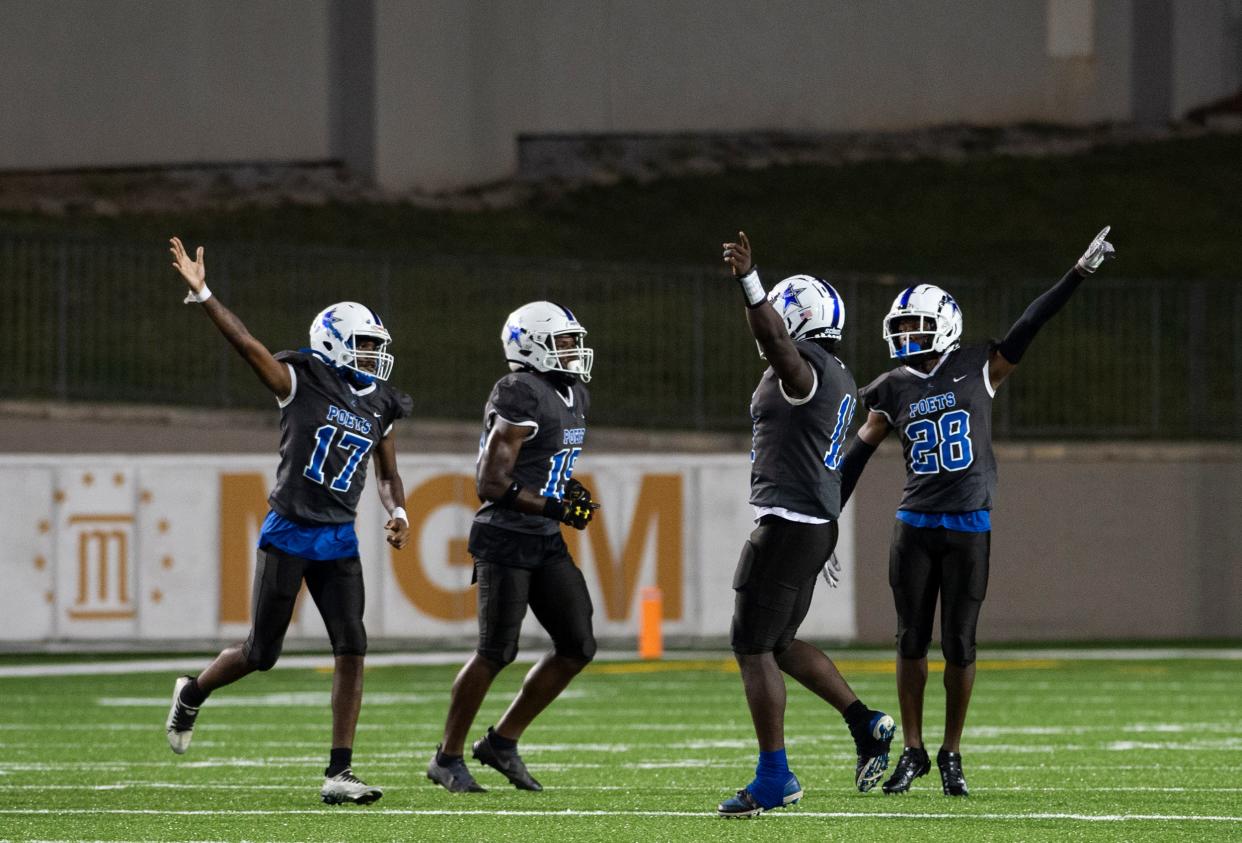 Lanier players celebrate a turnover at Cramton Bowl in Montgomery, Ala., on Friday, Sept. 22, 2023. Lanier leads Park Crossing 18-0 at halftime.
