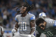 Detroit Lions running back Jamaal Williams (30) reacts to scoring a one-yard touchdown run against the Baltimore Ravens in the second half of an NFL football game in Detroit, Sunday, Sept. 26, 2021. (AP Photo/Tony Ding)