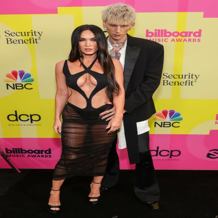 Megan, with her hair down, with Machine Gun Kelly at the Billboard Music Awards