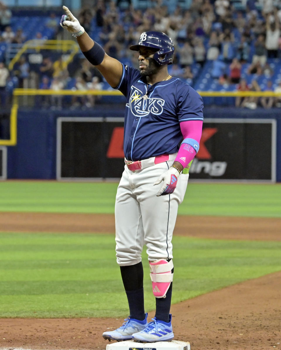 Tampa Bay Rays first baseman Yandy Díaz gestures to his dugout after hitting a bases-loaded, two-run single off Seattle Mariners reliever Andrés Muñoz during the eighth inning of a baseball game Monday, June 24, 2024, in St. Petersburg, Fla. (AP Photo/Steve Nesius)