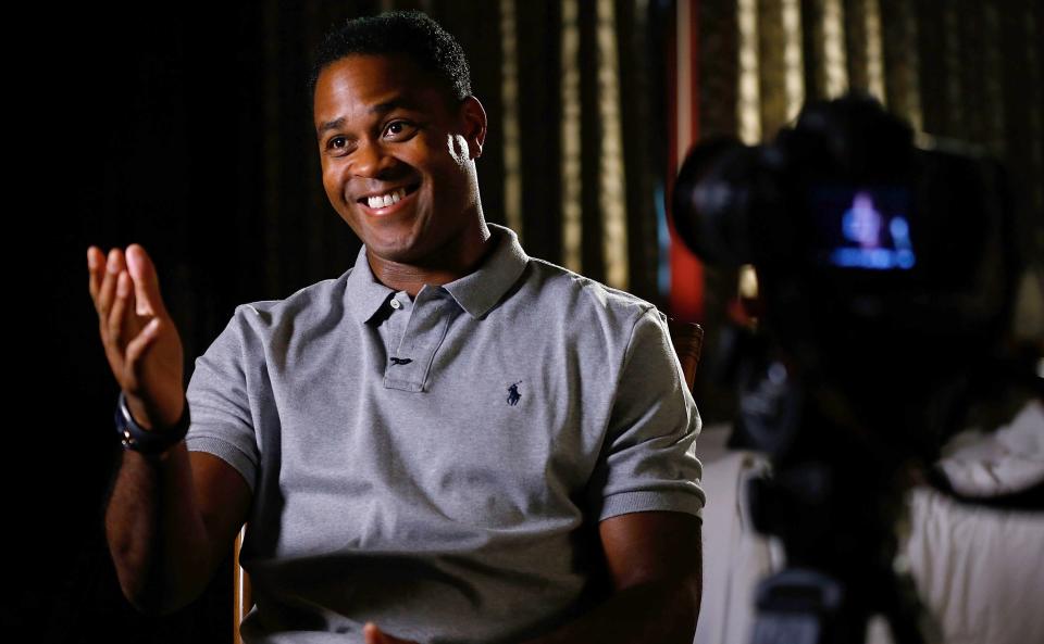 DALLAS, TX - APRIL 17:  Curacao national football team coach Patrick Kluivert is interviewed at Hotel Za Za to promote the 2015 UEFA Champions League Trophy Tour presented by Heineken on April 17, 2015 in Dallas, Texas.  (Photo by Mike Stone/Getty Images)