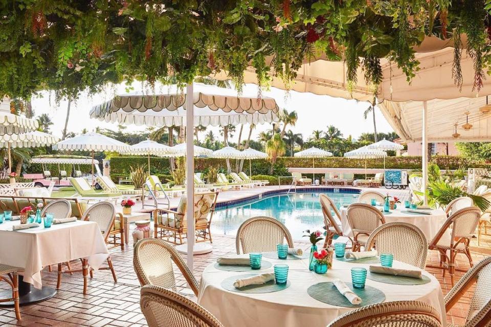 Poolside seating at Swifty's sets the stage for Sunday brunch, which currently features guitarist/vocalist Evan Grushka.