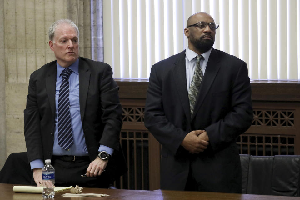 Shomari Legghette, right, and his attorney Scott Kamin, listens as the jury finds him guilty of first-degree murder in the Feb. 13, 2018, killing of Chicago Police Cmdr. Paul Bauer, Friday, March 13, 2020, at the Leighton Criminal Courthouse in Chicago. (Antonio Perez/Chicago Tribune via AP, Pool)