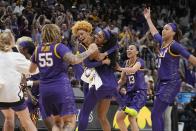 LSU players celebrate a last second shot during the first half of the NCAA Women's Final Four championship basketball game against Iowa Sunday, April 2, 2023, in Dallas. (AP Photo/Darron Cummings)