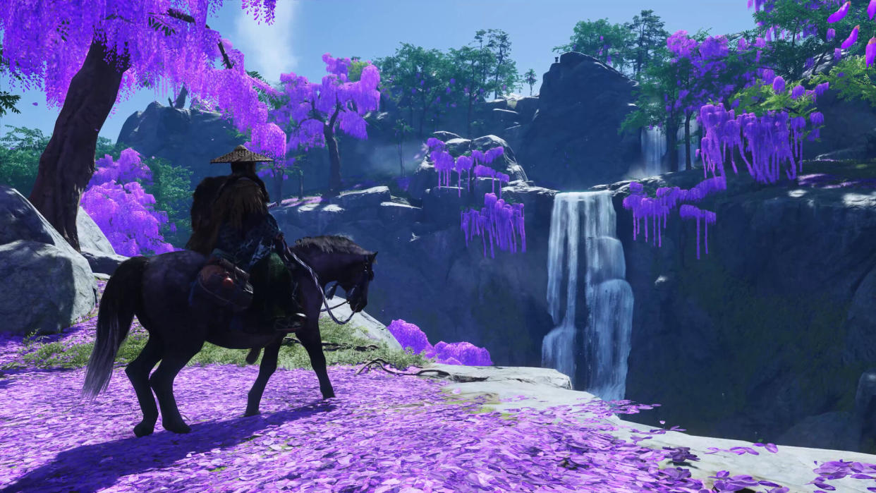  Ghost of Tsushima horse choice - a samurai is riding a horse towards a ravine with purple blossoms on trees nearby. 