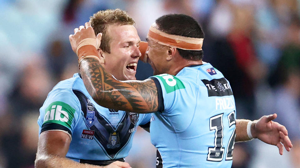 Seen here, NSW stars Jake Trbojevic and Tyson Frizell celebrate the Blues' Game II win.