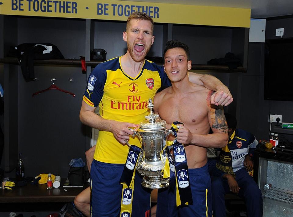 Mesut Ozil celebrates winning the FA CupGetty