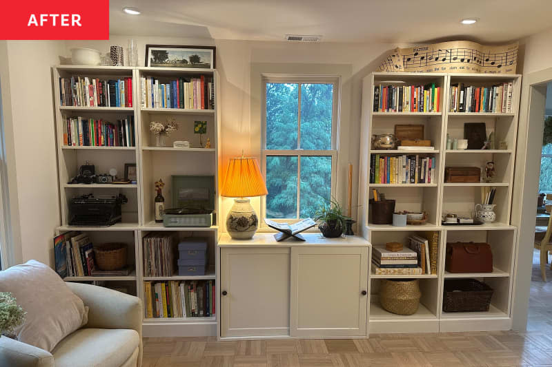 Bookshelves and cabinet in a white renovated entryway.