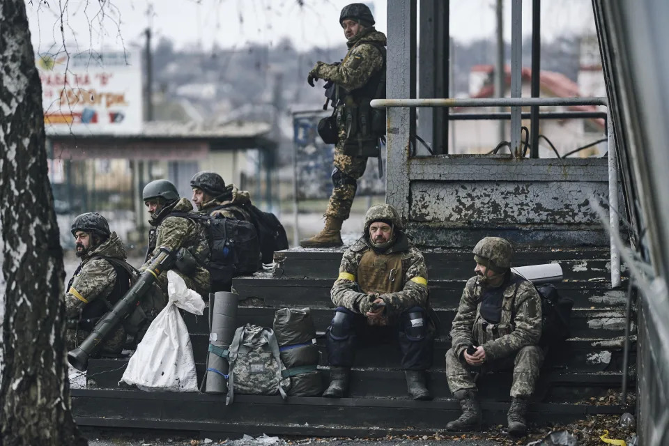 FILE - Ukrainian soldiers rest near their position in Bakhmut, Donetsk region, Ukraine, Saturday, Dec. 17, 2022. (AP Photo/LIBKOS, File)