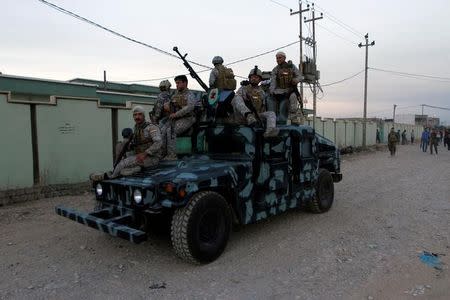 Iraqi Kurdish security forces patrol a street in the city of Kirkuk, Iraq, October 22, 2016. REUTERS/Ako Rasheed