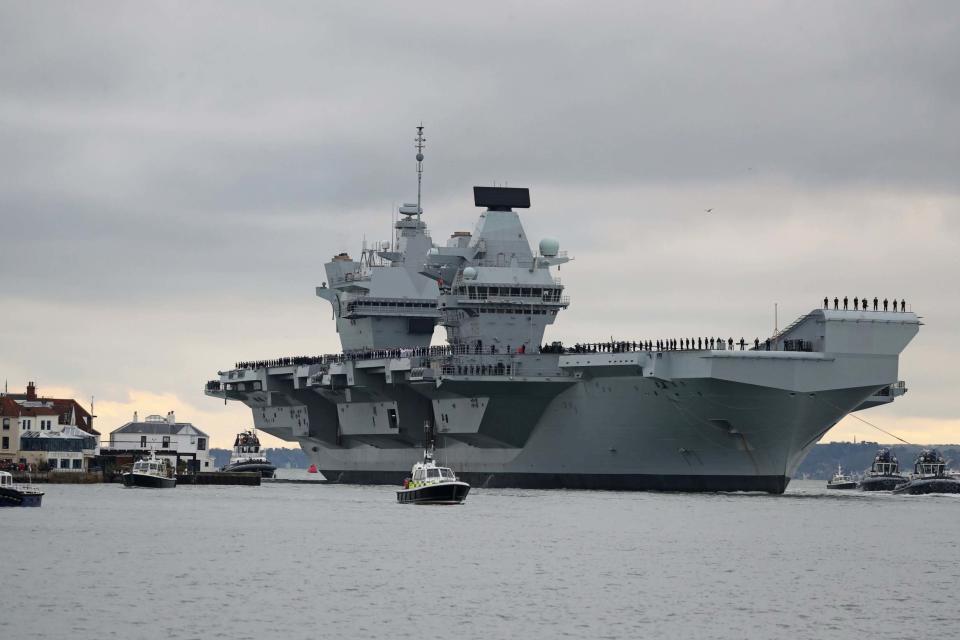 The aircraft carrier HMS Prince of Wales arrives at Portsmouth Naval Base (PA)