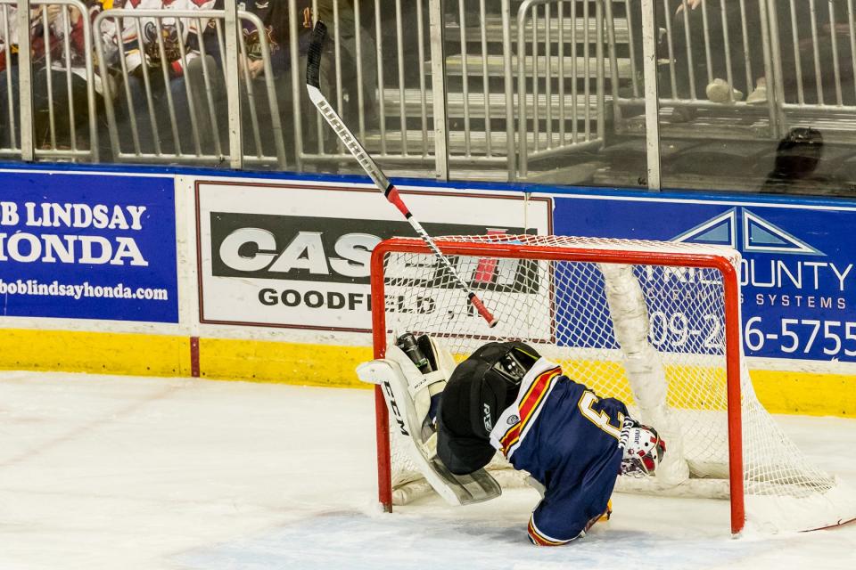 Peoria Rivermen goaltender Eric Levine upended in the net during an SPHL game against Knoxville on Sunday, Jan. 15, 2023 at Carver Arena.