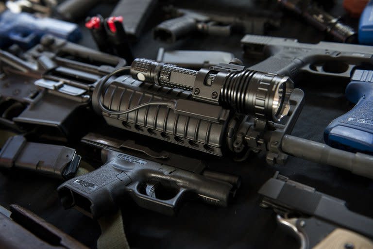 Firearms and training guns including an AR-15 rifle are seen in the Blevins 's garage December 5, 2012 in Berryville, Virginia. Blevins is a "prepper," one of a growing number of Americans making big plans for bad times