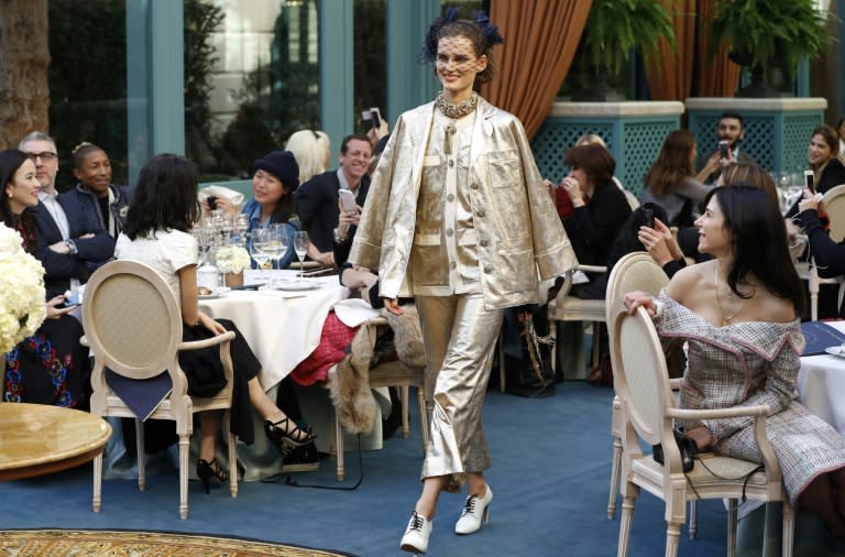 Models rarely smile on the Paris catwalk, but for Chanel they positively beamed as they skipped between the tables of the Ritz tearoom