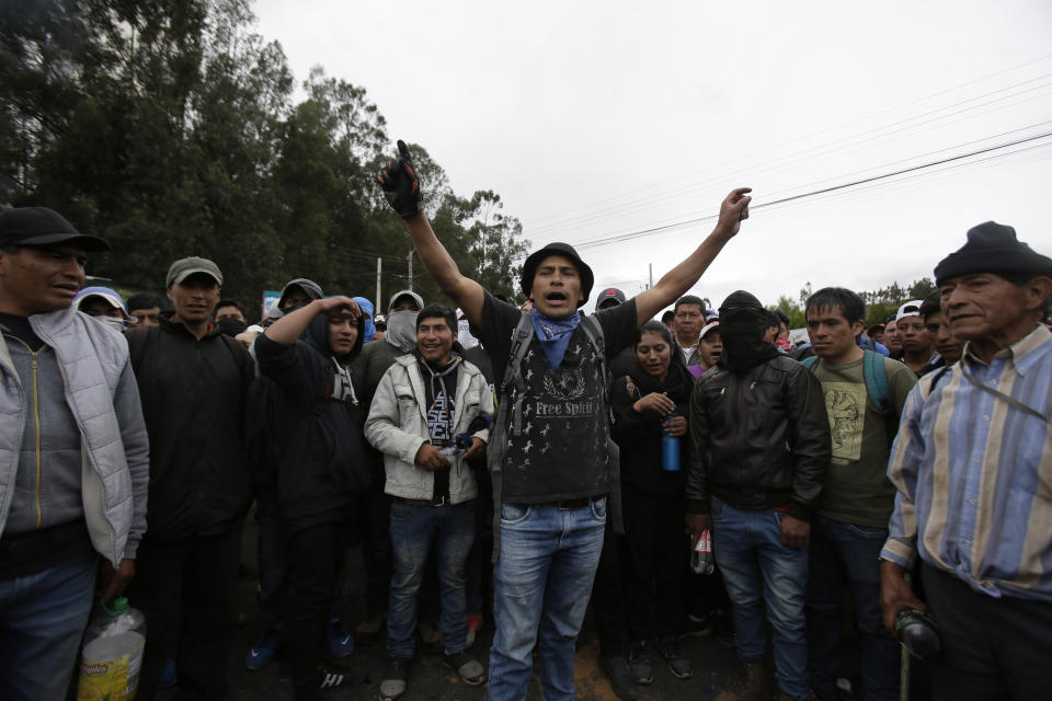Residents block a main road during a transport strike that shut down taxi, bus and other services in response to a sudden rise in fuel prices, in Cangahua, Ecuador Friday, Oct. 4, 2019. Ecuador's president has declared a state of emergency to confront rowdy street protests and a nationwide transport strike over his decision to end government fuel subsidies and relax labor protections(AP Photo/Dolores Ochoa)