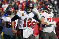 Tampa Bay Buccaneers quarterback Tom Brady (12) walks off after a drive stalled against the Los Angeles Rams during the first half of an NFL divisional round playoff football game Sunday, Jan. 23, 2022, in Tampa, Fla. (AP Photo/Mark LoMoglio)