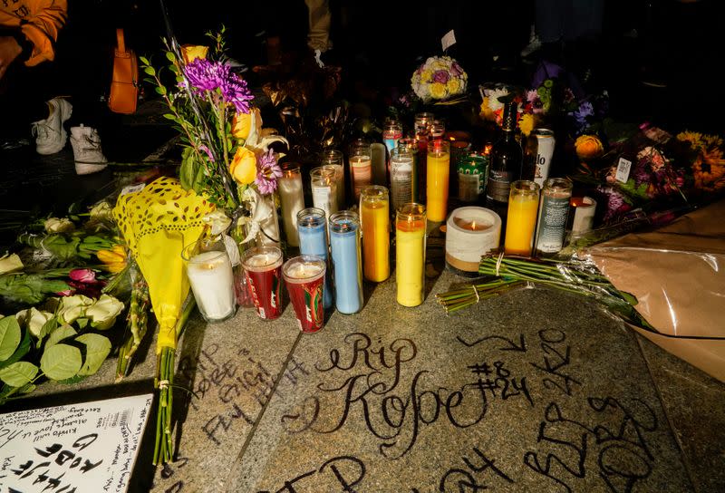 Mourners gather in Microsoft Square near the Staples Center to pay respects to Kobe Bryant after a helicopter crash killed the retired basketball star, in Los Angeles