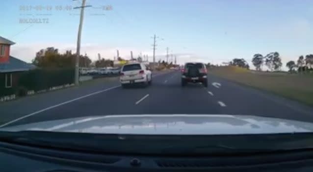 Both cars almost fly off the road when the white Landcruiser smashes into the P-plater. Photo: Facebook/ Dash Cam Owners Australia